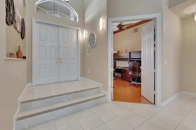 a large kitchen with a table and chairs