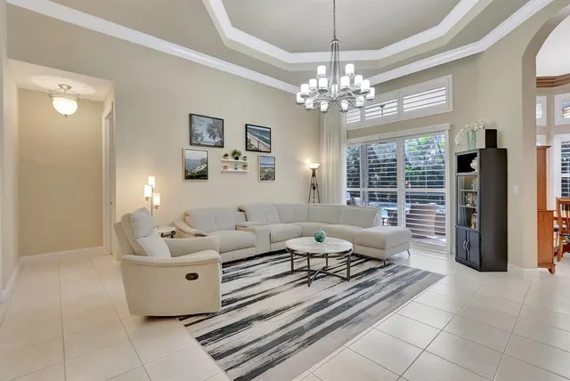 a kitchen with stainless steel appliances granite countertop a refrigerator a sink a stove a microwave and island