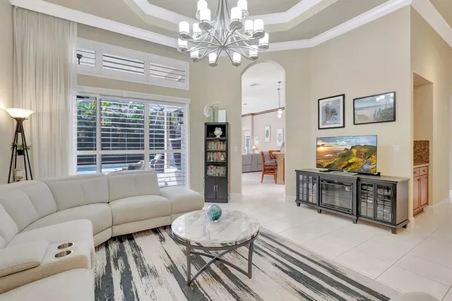 a large kitchen with kitchen island a stove a sink a dining table and chairs