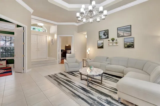 a kitchen with stainless steel appliances granite countertop a sink and a refrigerator