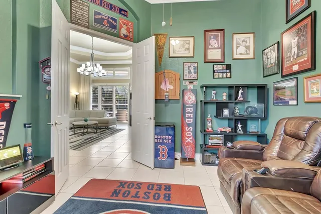 a bedroom with bed and window
