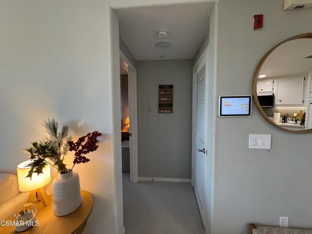 a view of a hallway with washer and dryer