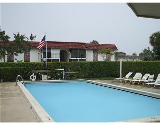 22775 Southwest 66th Avenue, Unit 1070 Boca Raton, FL 33428 - Photo 5 of 5 a view of a house with pool porch and chairs