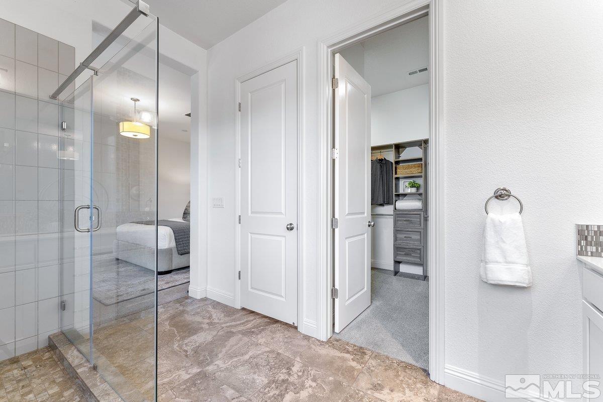 9815 Sea Bird Lane Reno, NV 89521 - Photo 17 of 40 a bathroom with a shower and a sink