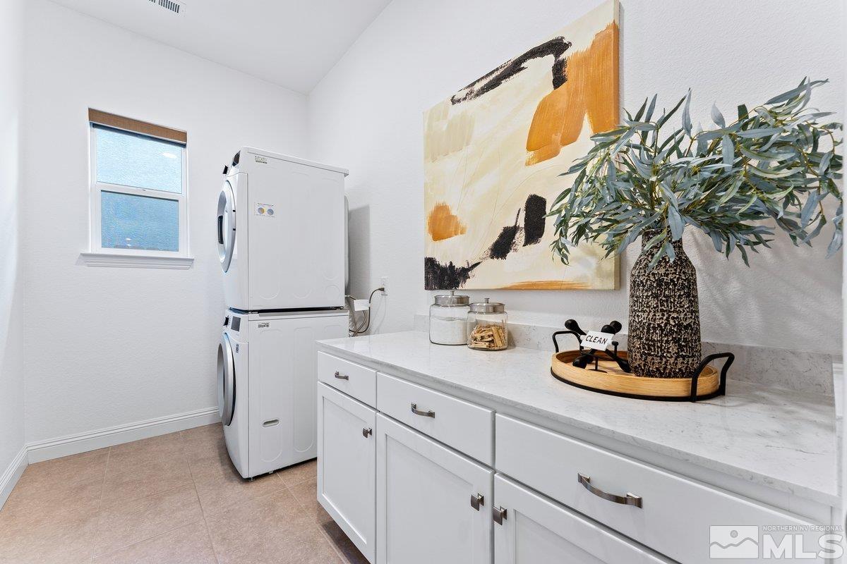 9815 Sea Bird Lane Reno, NV 89521 - Photo 22 of 40 a kitchen with a refrigerator and a stove