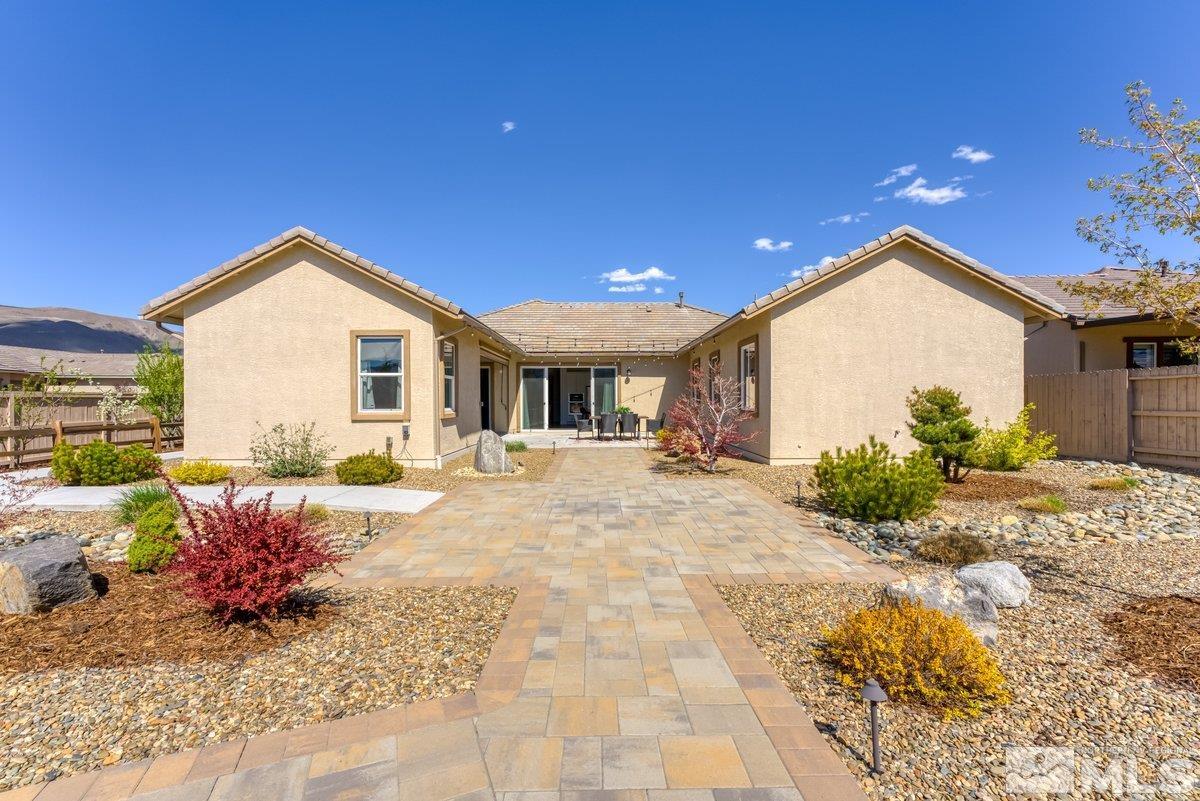 9815 Sea Bird Lane Reno, NV 89521 - Photo 26 of 40 a front view of a house with a yard