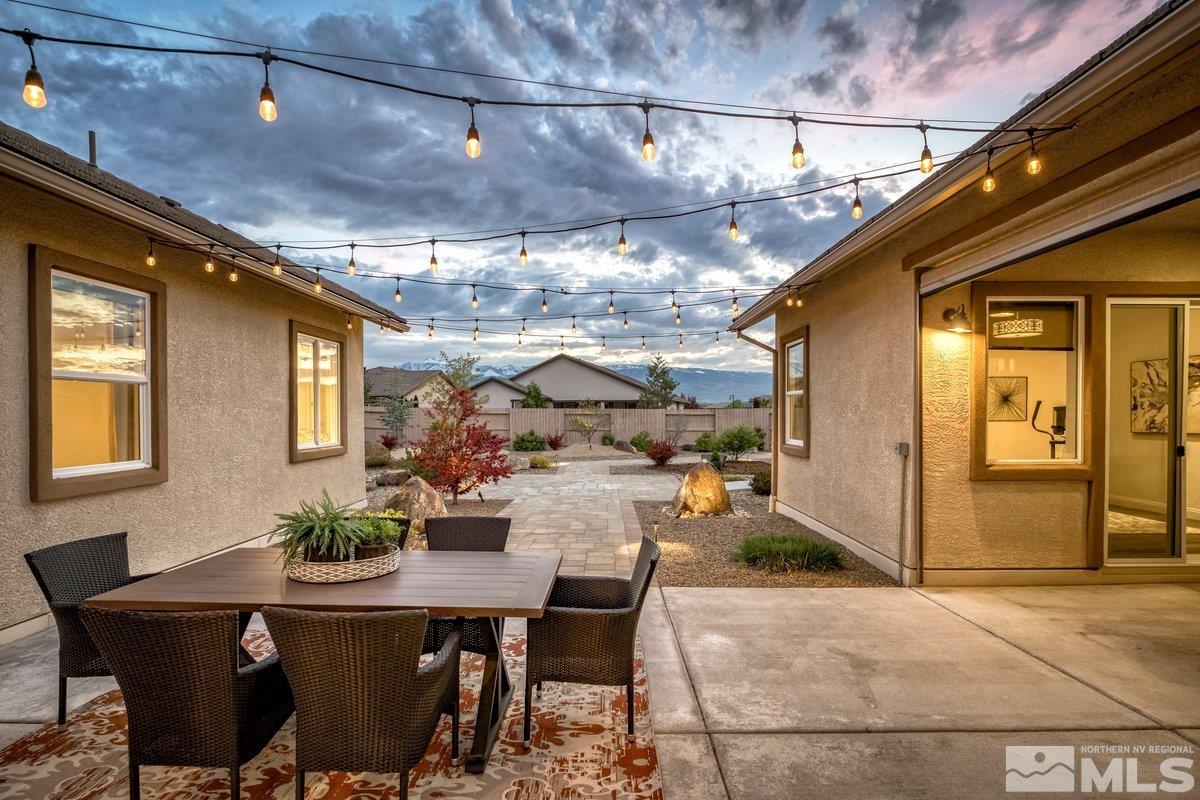 9815 Sea Bird Lane Reno, NV 89521 - Photo 29 of 40 a view of a patio with a table and chairs