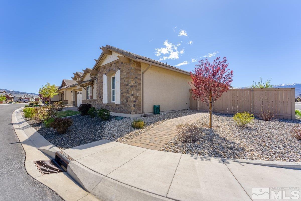 9815 Sea Bird Lane Reno, NV 89521 - Photo 3 of 40 a front view of a house with a yard