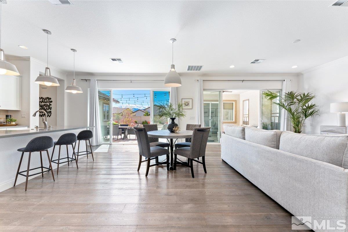 9815 Sea Bird Lane Reno, NV 89521 - Photo 4 of 40 a view of a dining room with furniture window and wooden floor