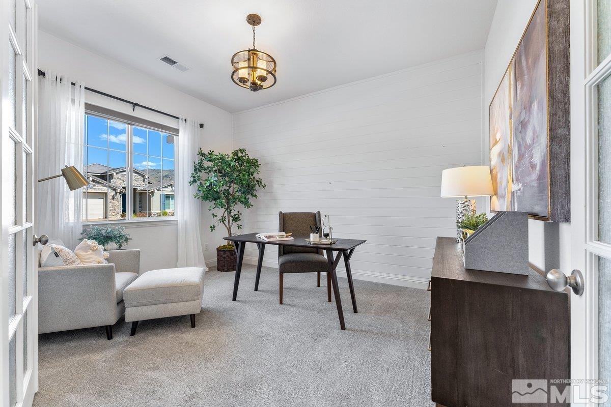 9815 Sea Bird Lane Reno, NV 89521 - Photo 5 of 40 a work room with furniture and a potted plant