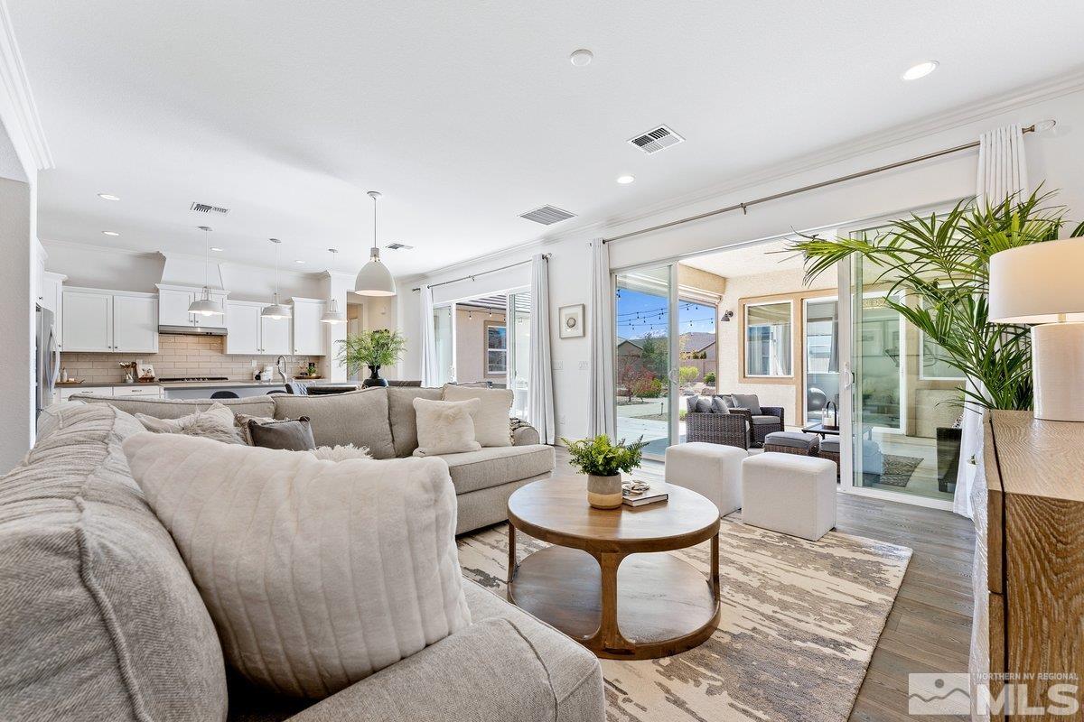 9815 Sea Bird Lane Reno, NV 89521 - Photo 8 of 40 a living room with furniture kitchen view and a large window