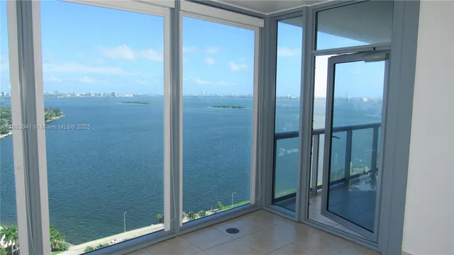 a bathroom with a glass shower door and a mirror
