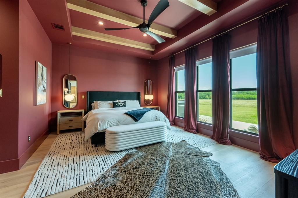 2396 County Road 2145 Cooper, TX 75432 - Photo 21 of 40 a bedroom with a large bed and a large window