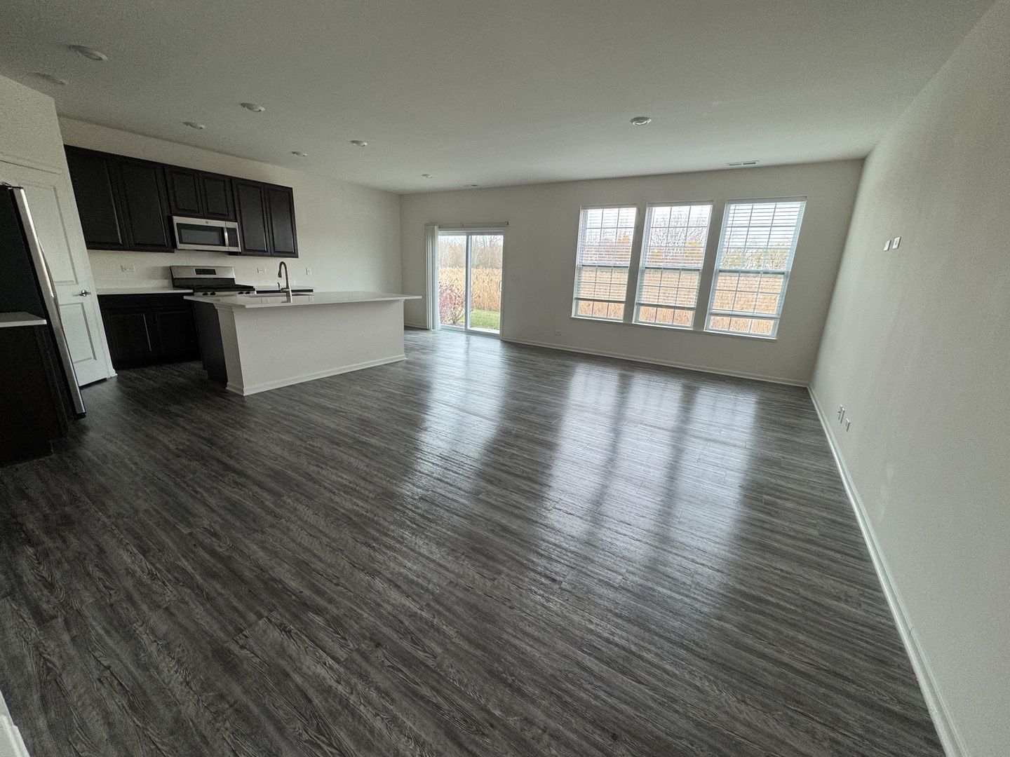 1209 Draper Road McHenry, IL 60050 - Photo 2 of 16 a view of a kitchen with microwave and cabinets