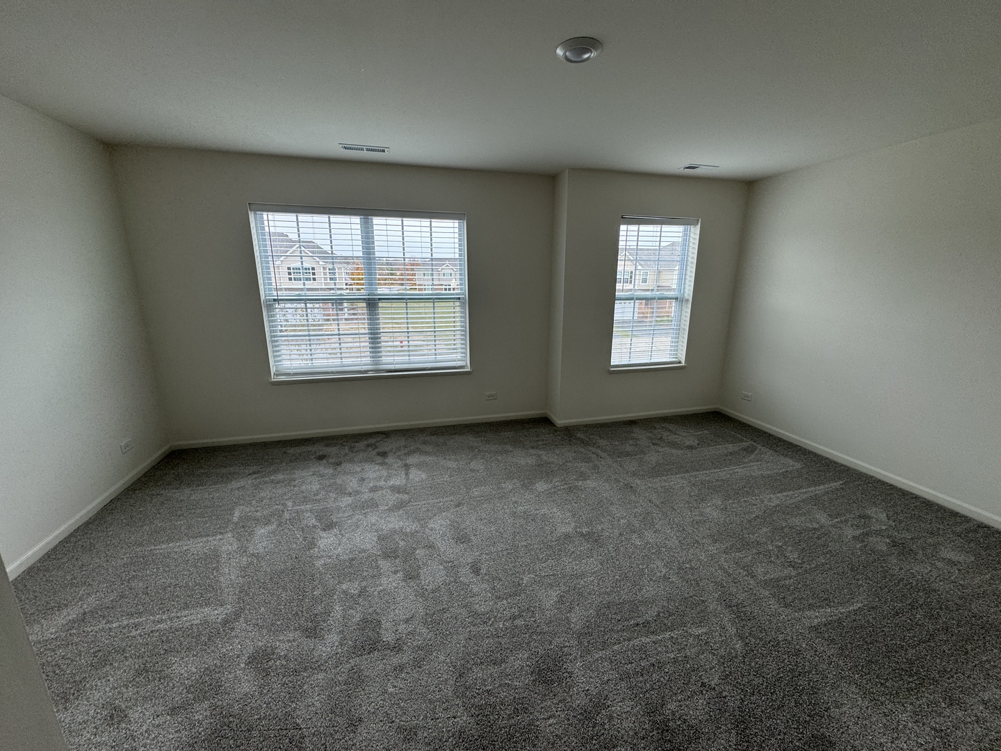 1209 Draper Road McHenry, IL 60050 - Photo 4 of 16 an empty room with a window