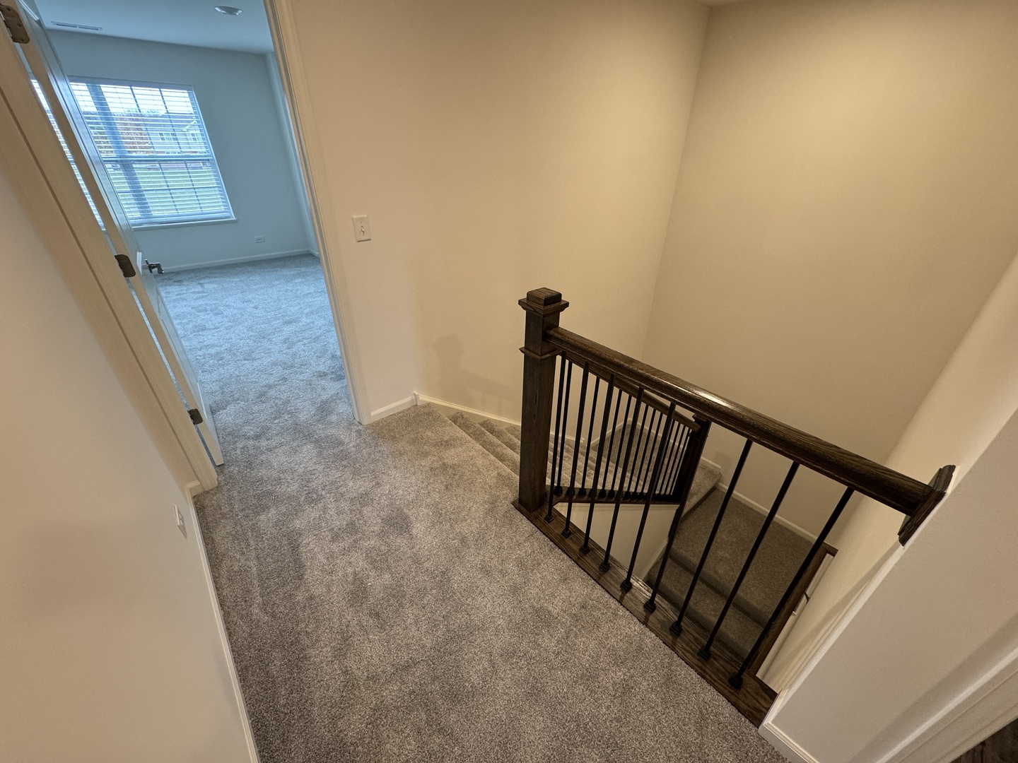1209 Draper Road McHenry, IL 60050 - Photo 7 of 16 a view of a hallway with wooden floor and staircase
