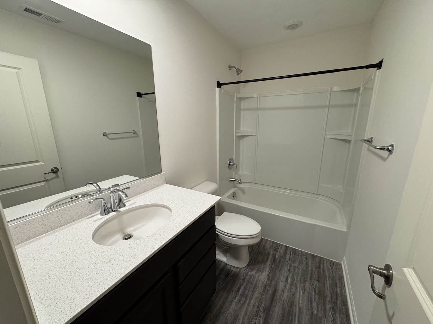 1209 Draper Road McHenry, IL 60050 - Photo 10 of 16 a bathroom with a sink a toilet and shower