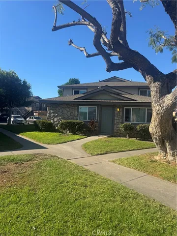 a view of house with outdoor space and swimming pool