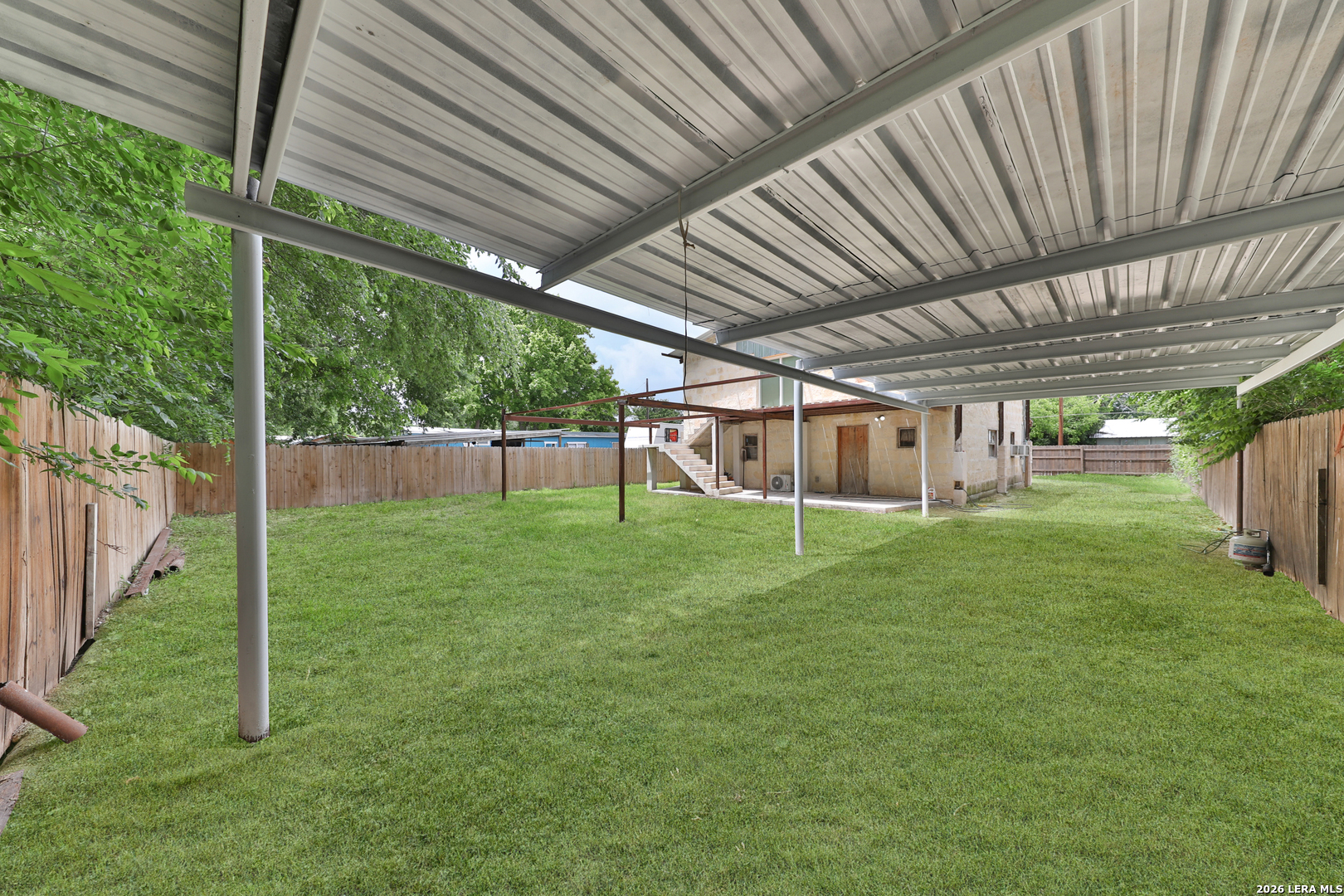 122 Brink Center Point, TX 78010 - Photo 34 of 40 a view of a backyard with a big garden
