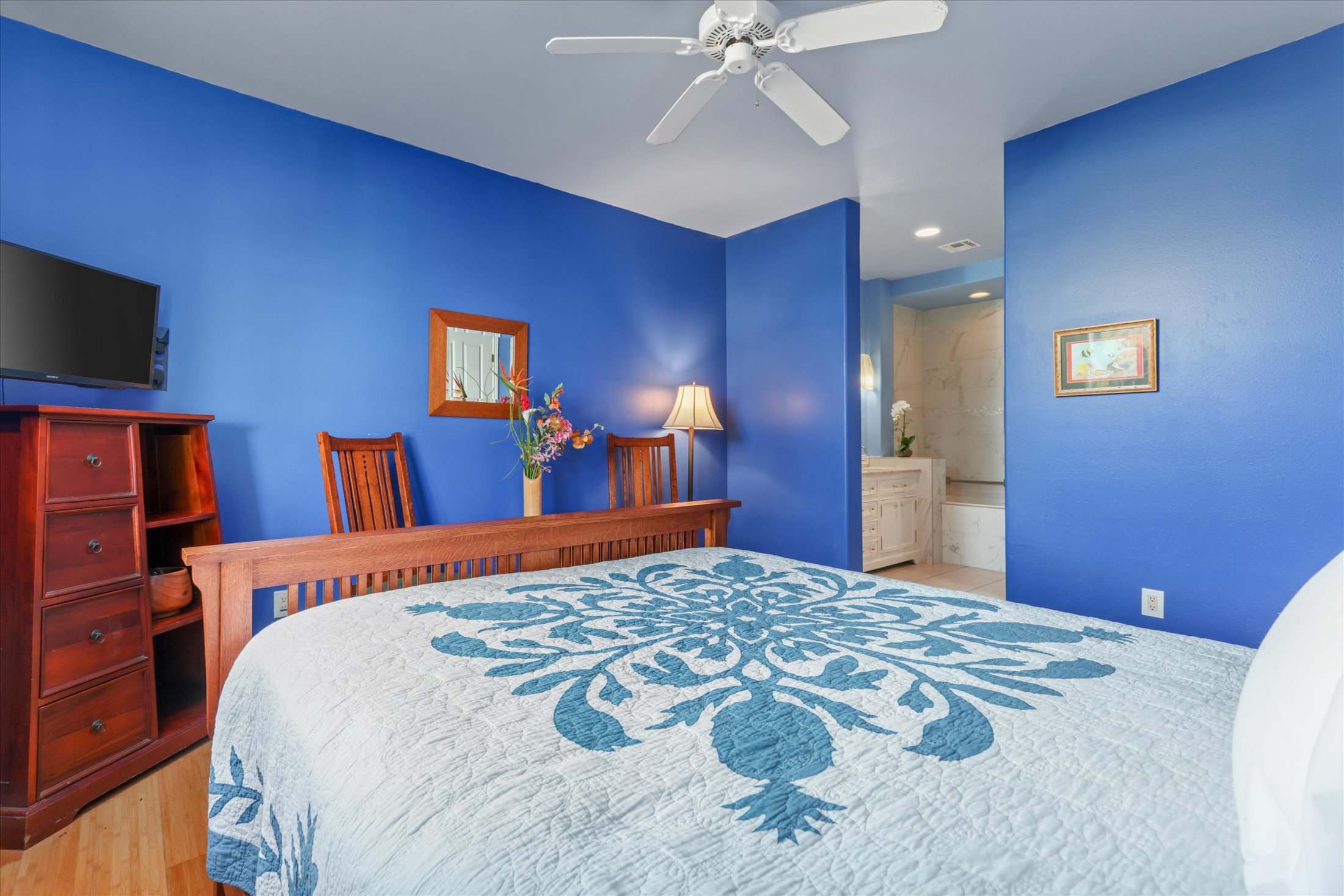 69-200 Pohakulana Place, Unit G5 Waikoloa, HI 96738 - Photo 14 of 27 a bedroom with a bed and a flat screen tv