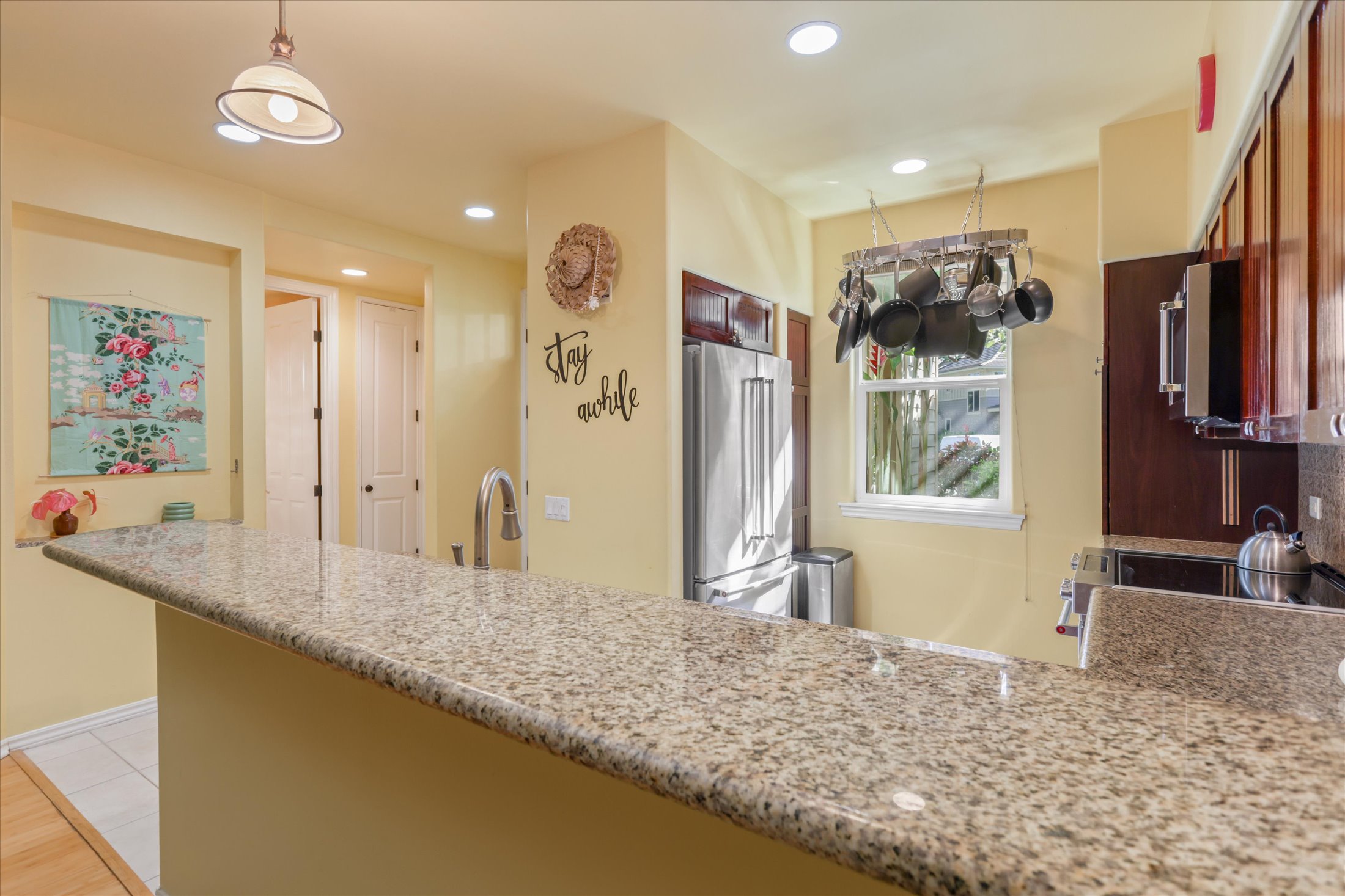 69-200 Pohakulana Place, Unit G5 Waikoloa, HI 96738 - Photo 4 of 27 a bathroom with a granite countertop sink and a large mirror