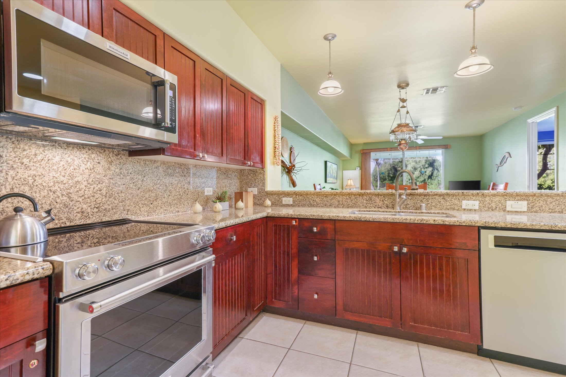 69-200 Pohakulana Place, Unit G5 Waikoloa, HI 96738 - Photo 6 of 27 a kitchen with a sink stove and microwave
