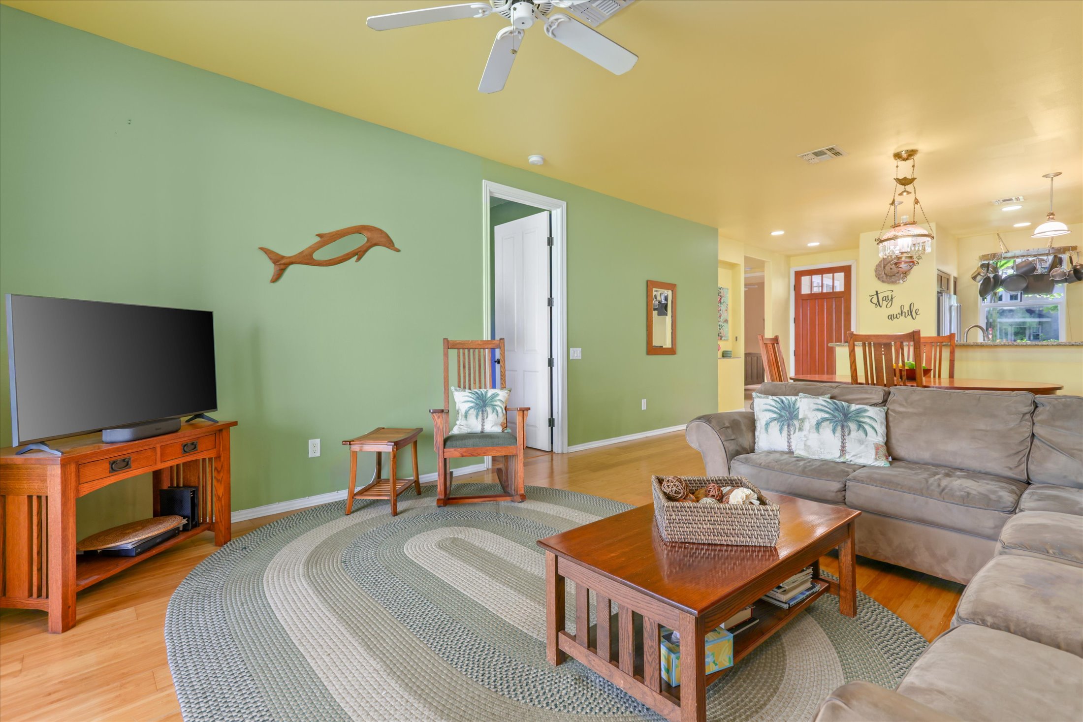 69-200 Pohakulana Place, Unit G5 Waikoloa, HI 96738 - Photo 7 of 27 a living room with furniture and a flat screen tv