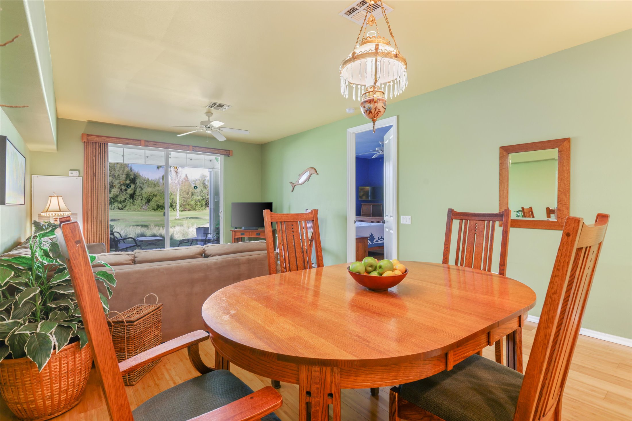 69-200 Pohakulana Place, Unit G5 Waikoloa, HI 96738 - Photo 9 of 27 a view of a dining room with furniture window and wooden floor