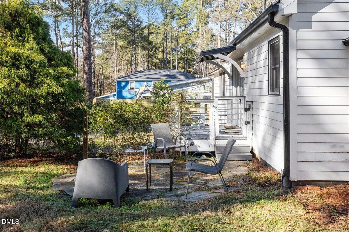 1005 West Main Street Carrboro, NC 27510 - Photo 20 of 27 a view of backyard with outdoor seating and plants