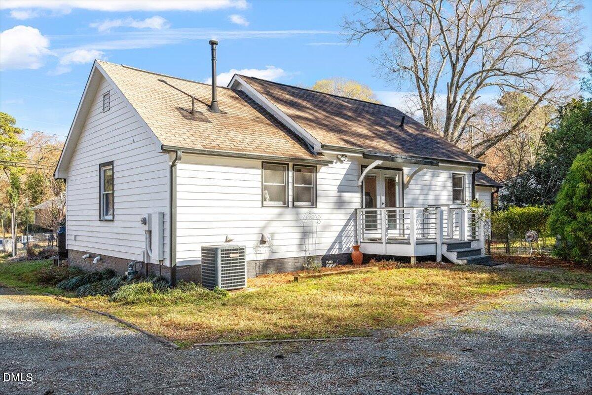 1005 West Main Street Carrboro, NC 27510 - Photo 25 of 27 a view of a house with a yard