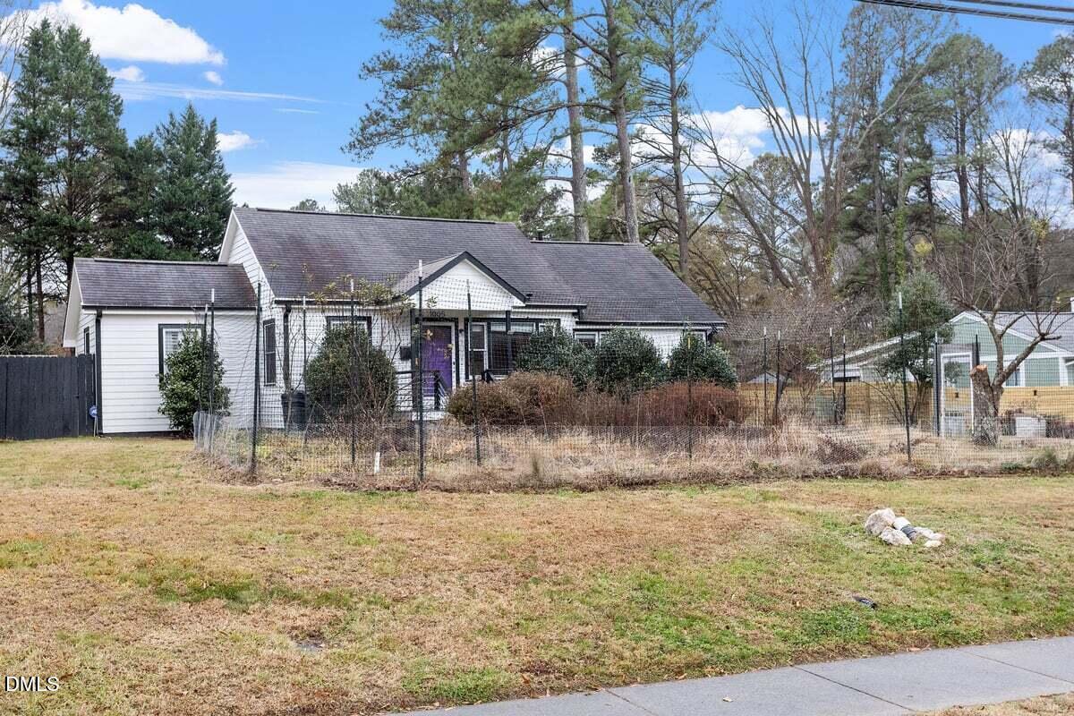 1005 West Main Street Carrboro, NC 27510 - Photo 26 of 27 a view of a house with a yard