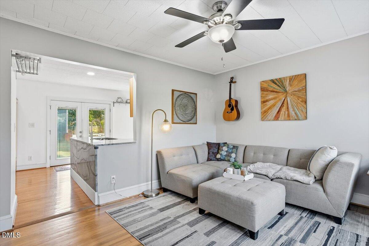 1005 West Main Street Carrboro, NC 27510 - Photo 2 of 27 a living room with furniture and a wooden floor