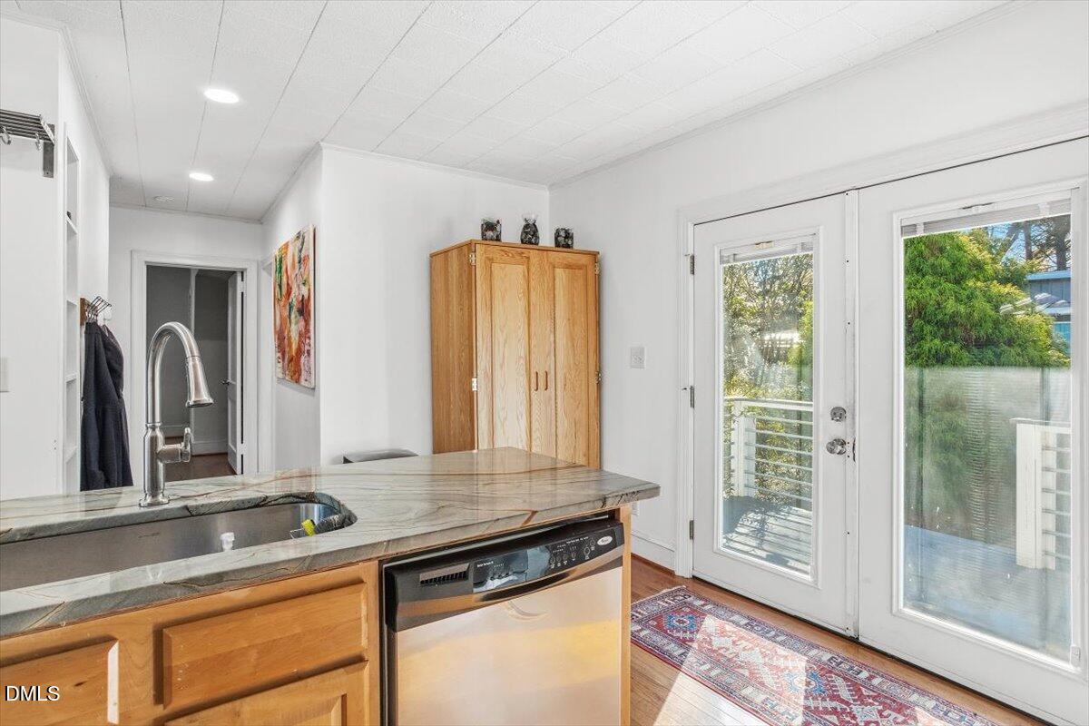 1005 West Main Street Carrboro, NC 27510 - Photo 7 of 27 a view of a kitchen with a sink and large window