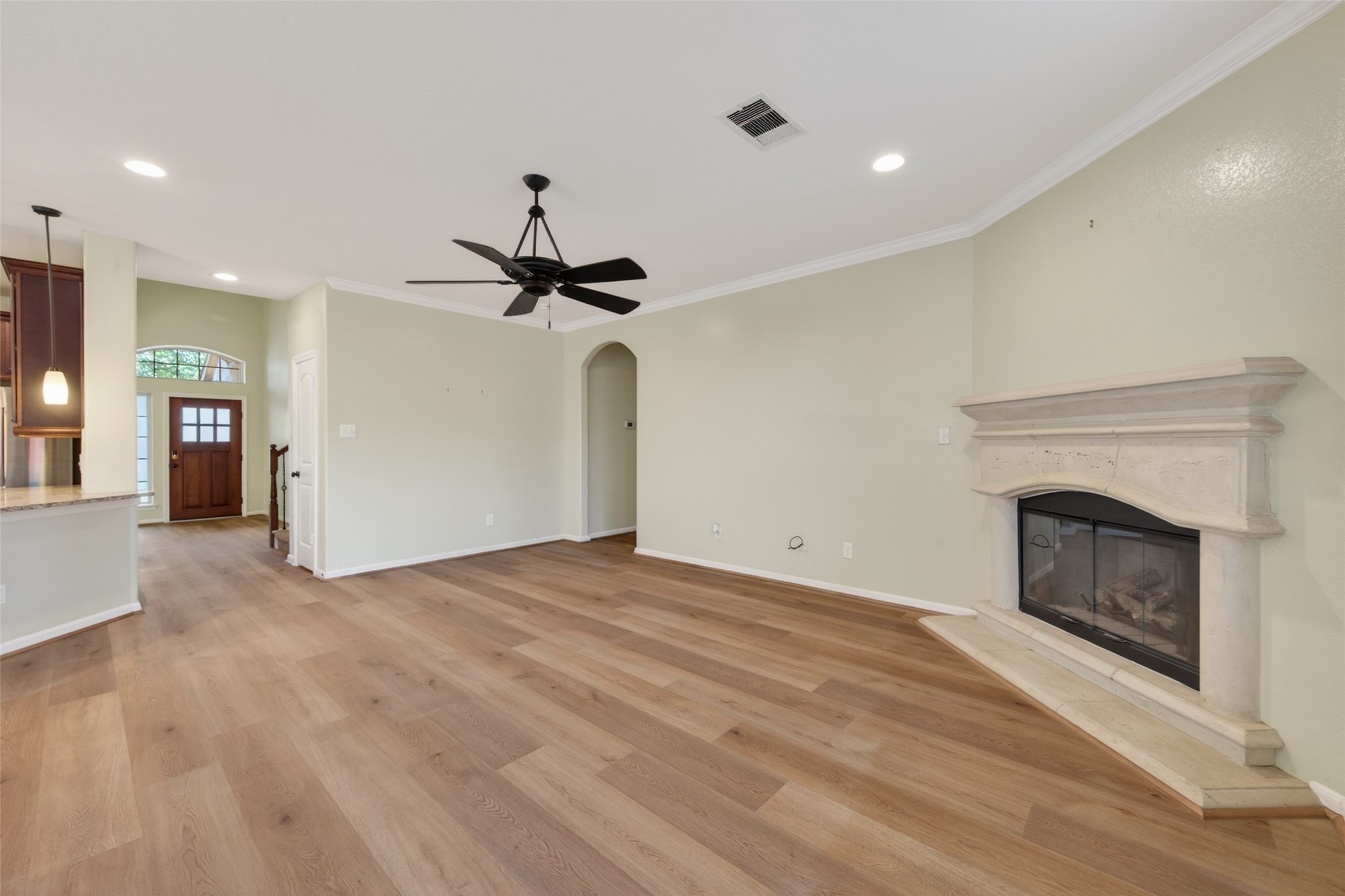 6 Painted Post Place Spring, TX 77389 - Photo 11 of 49 a view of empty room with wooden floor and fireplace