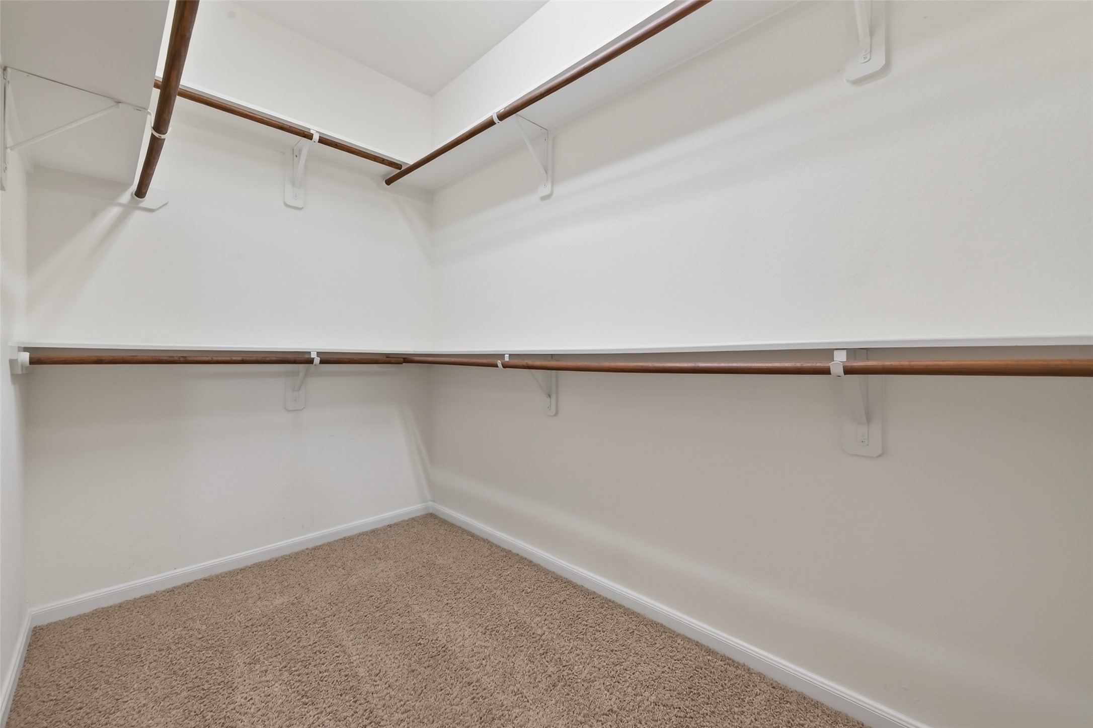 6 Painted Post Place Spring, TX 77389 - Photo 44 of 49 a view of a room with racks on the wall