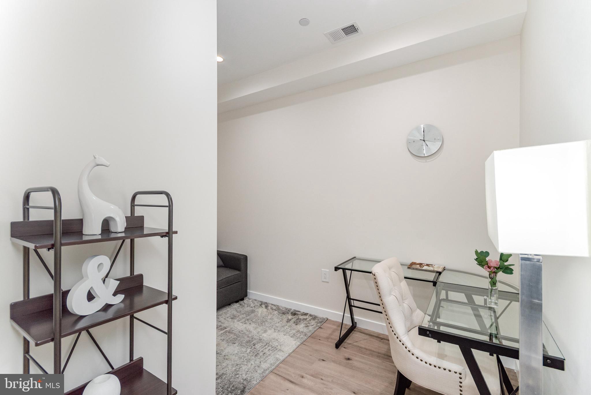 2116 4th Street Northeast, Unit A Washington, DC 20002 - Photo 9 of 17 a view of a dining room that has a table and chairs in it