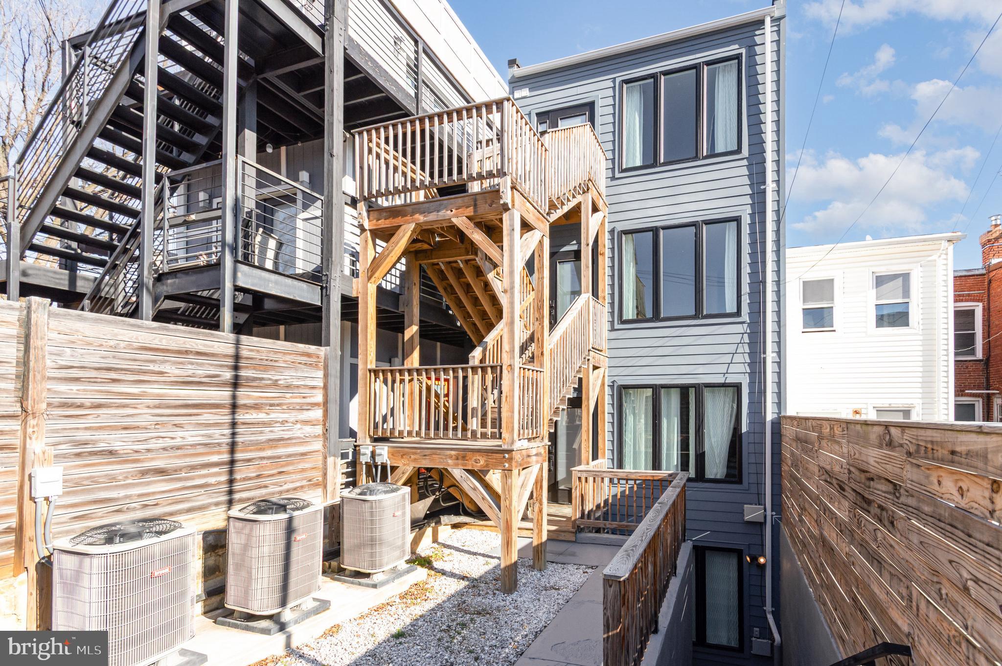 2116 4th Street Northeast, Unit A Washington, DC 20002 - Photo 12 of 17 a view of a patio with couches chairs and wooden floor