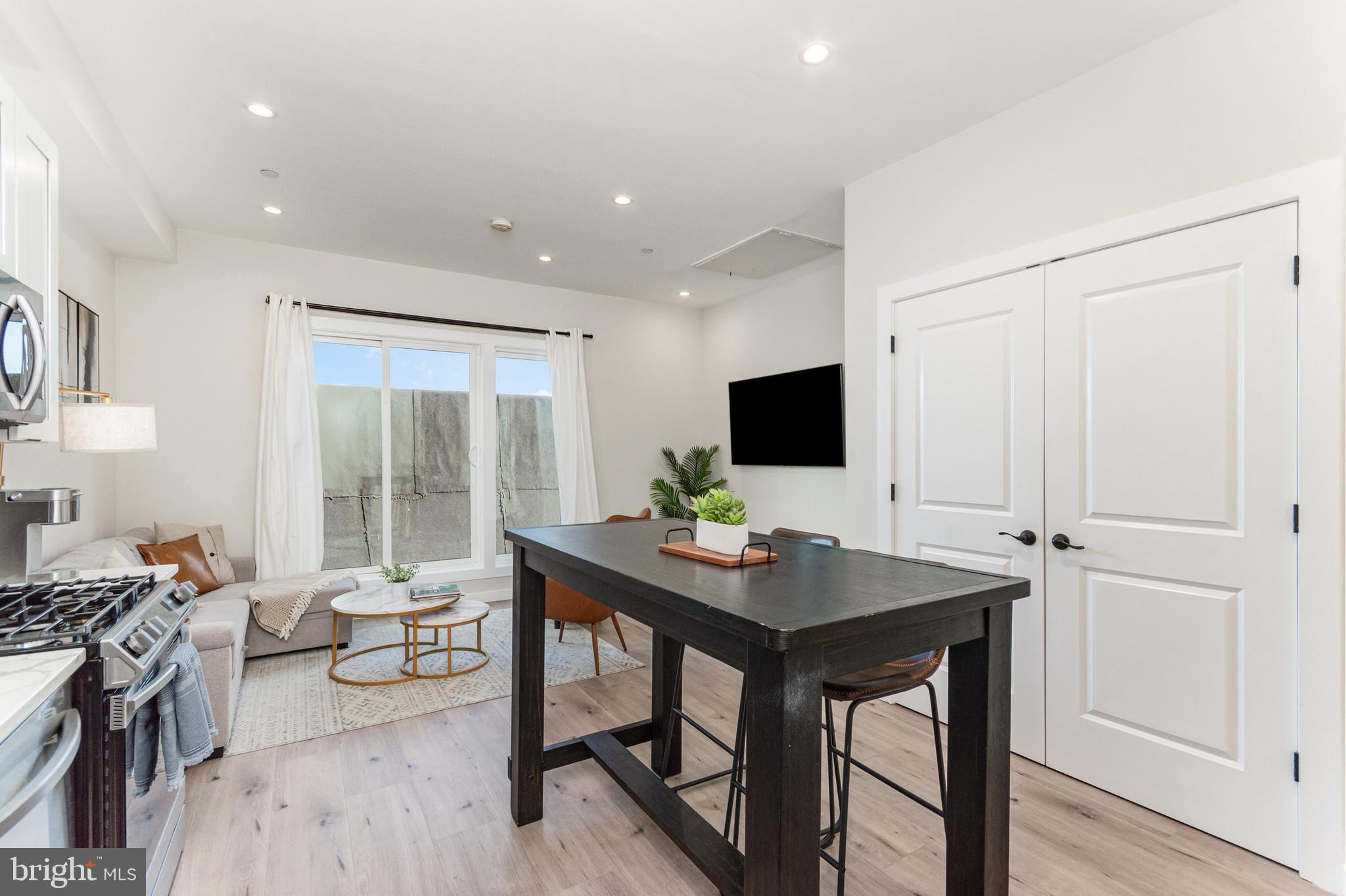 2116 4th Street Northeast, Unit A Washington, DC 20002 - Photo 16 of 17 a view of a workspace with furniture and wooden floor