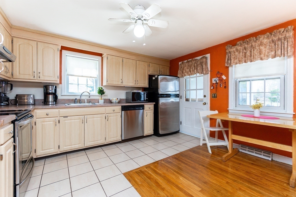 16 Birch Road Framingham, MA 01701 - Photo 14 of 39 a kitchen with a sink appliances cabinets and a dining table