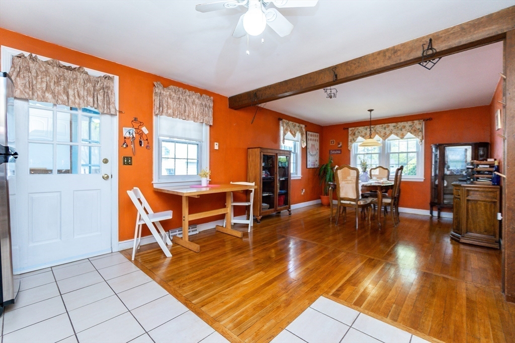 16 Birch Road Framingham, MA 01701 - Photo 19 of 39 a living room with furniture a dining table and chairs with wooden floor
