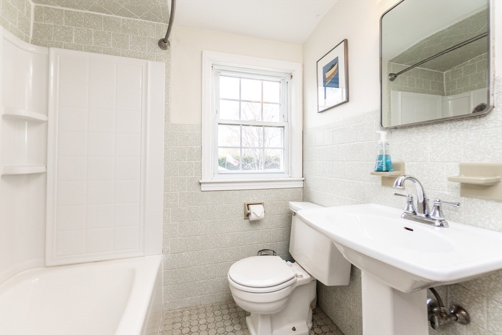 16 Birch Road Framingham, MA 01701 - Photo 24 of 39 a bathroom with a sink toilet and a mirror