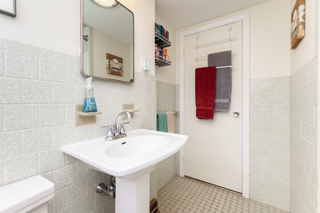 16 Birch Road Framingham, MA 01701 - Photo 25 of 39 a bathroom with a sink and a mirror