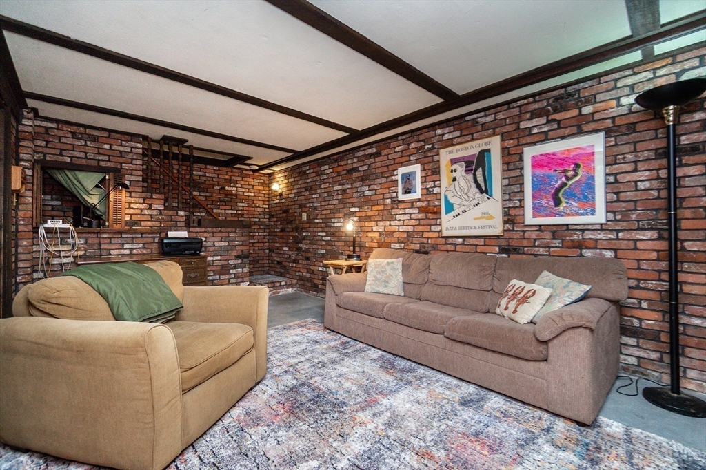 16 Birch Road Framingham, MA 01701 - Photo 29 of 39 a living room with furniture and a flat screen tv