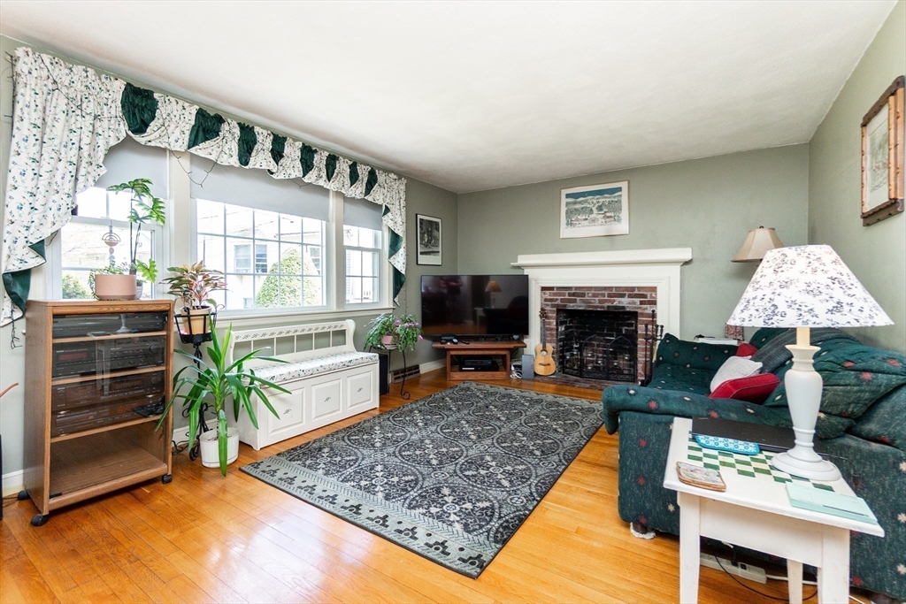 16 Birch Road Framingham, MA 01701 - Photo 3 of 39 a living room with furniture and a fireplace