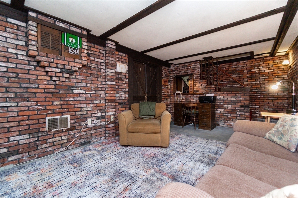 16 Birch Road Framingham, MA 01701 - Photo 37 of 39 a living room with furniture and a fireplace