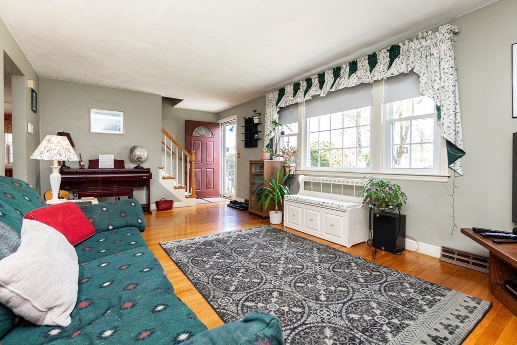 16 Birch Road Framingham, MA 01701 - Photo 4 of 39 a living room with furniture fireplace and wooden floor