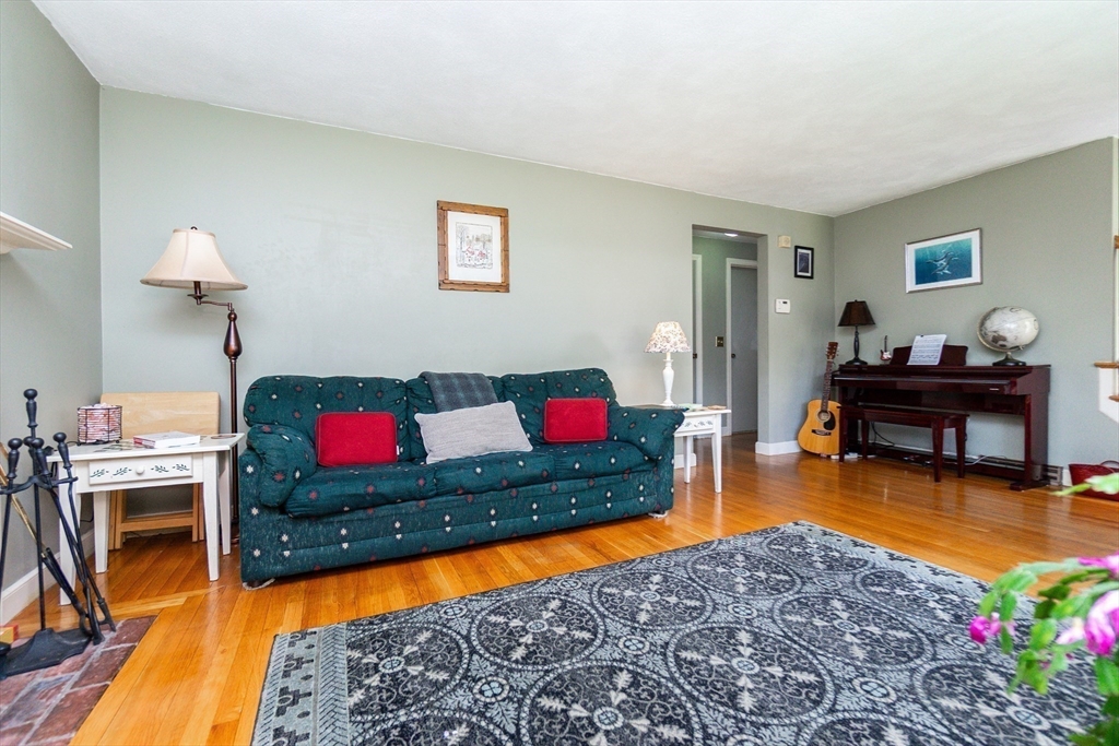 16 Birch Road Framingham, MA 01701 - Photo 6 of 39 a living room with furniture and a dining area