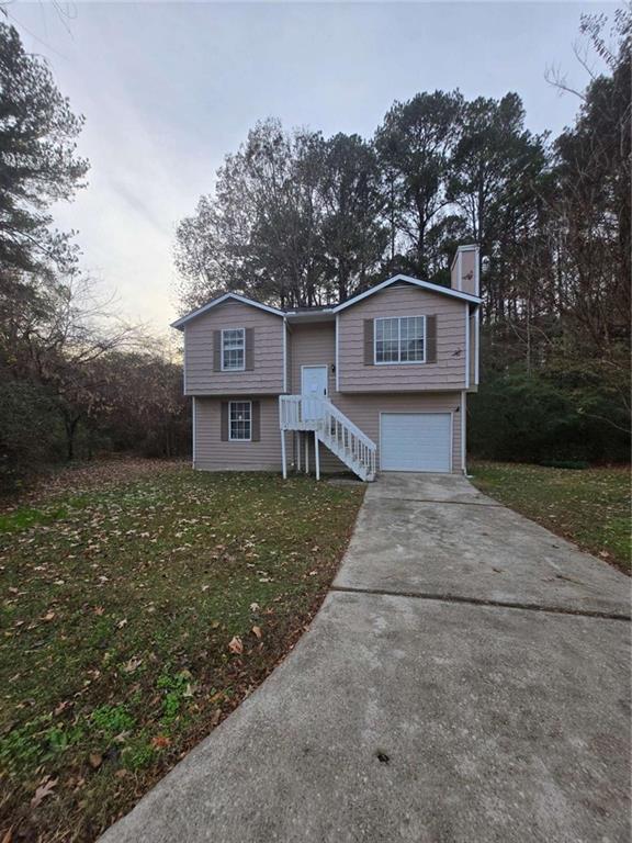 1717 Rondon Court Atlanta, GA 30316 - Photo 1 of 12 a view of a house with a yard plants and large tree