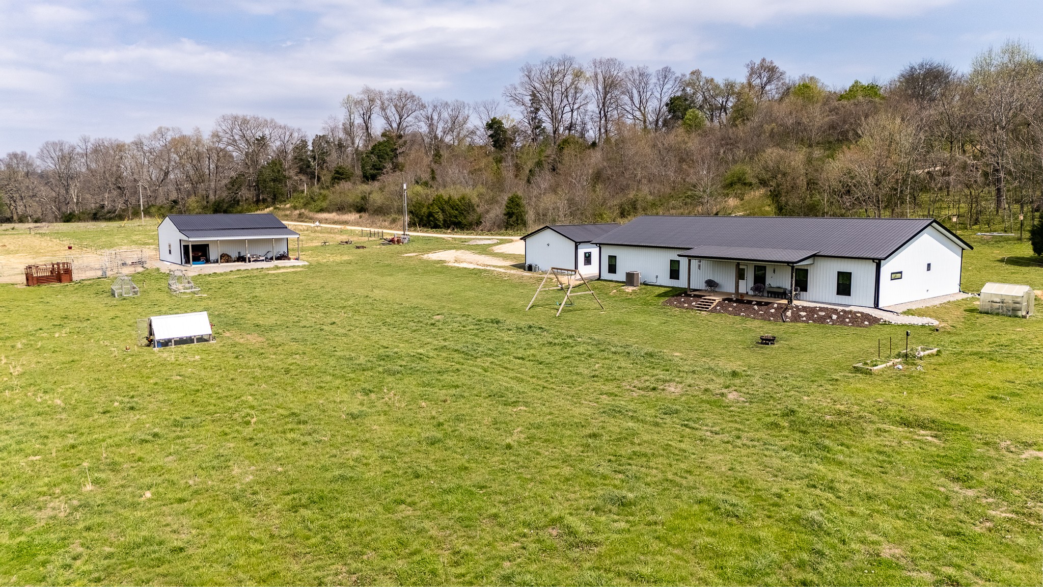 a aerial view of a house with swimming pool and big yard
