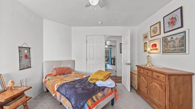 a bedroom with furniture and a chandelier